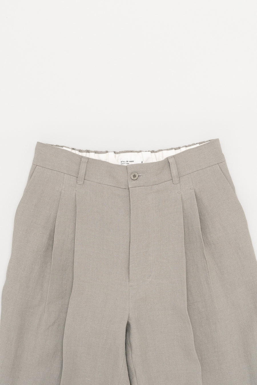 STILL BY HAND Two Tuck Wide Tapered Linen Pants